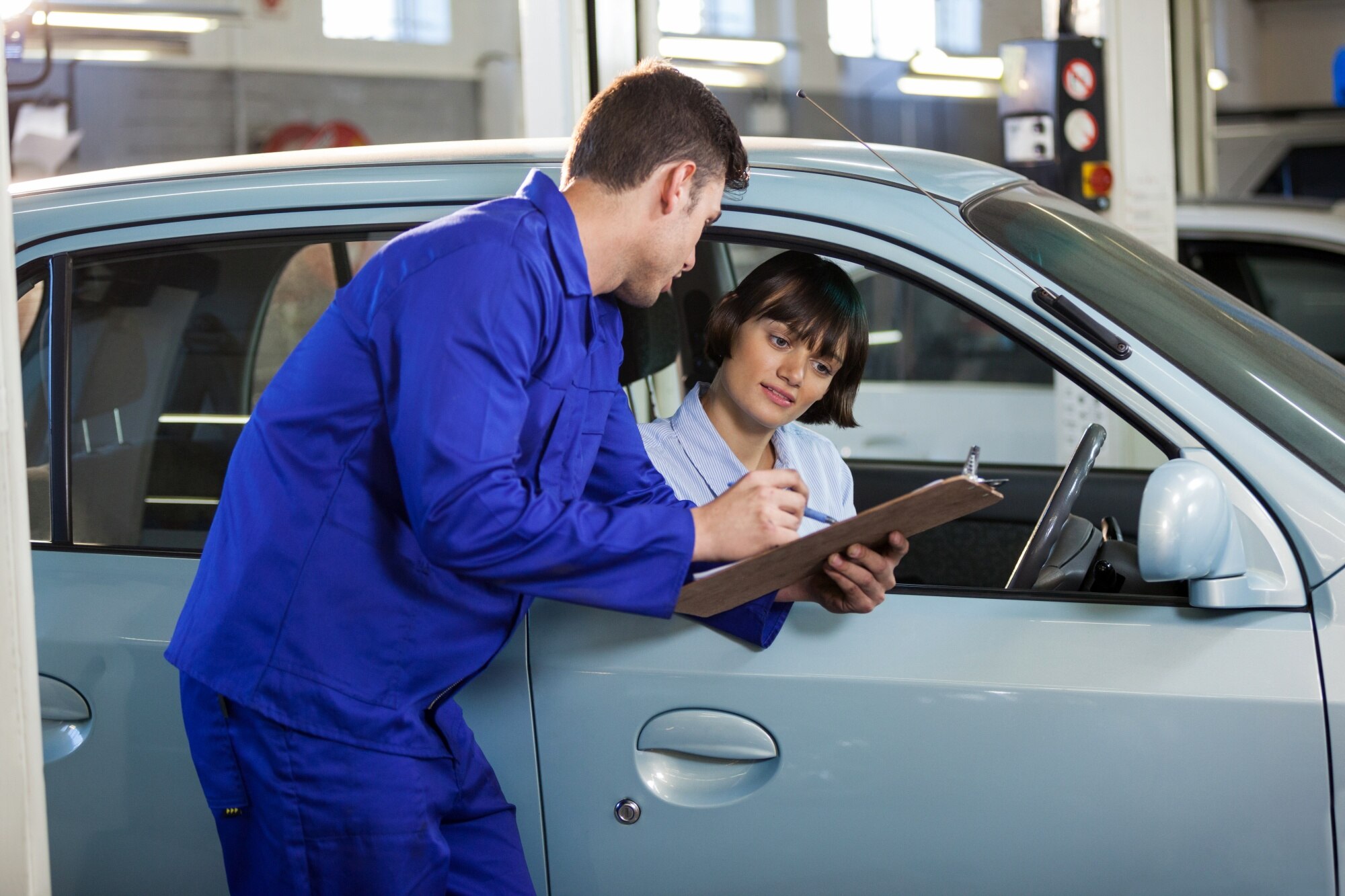 Mechanic inspecting a car engine